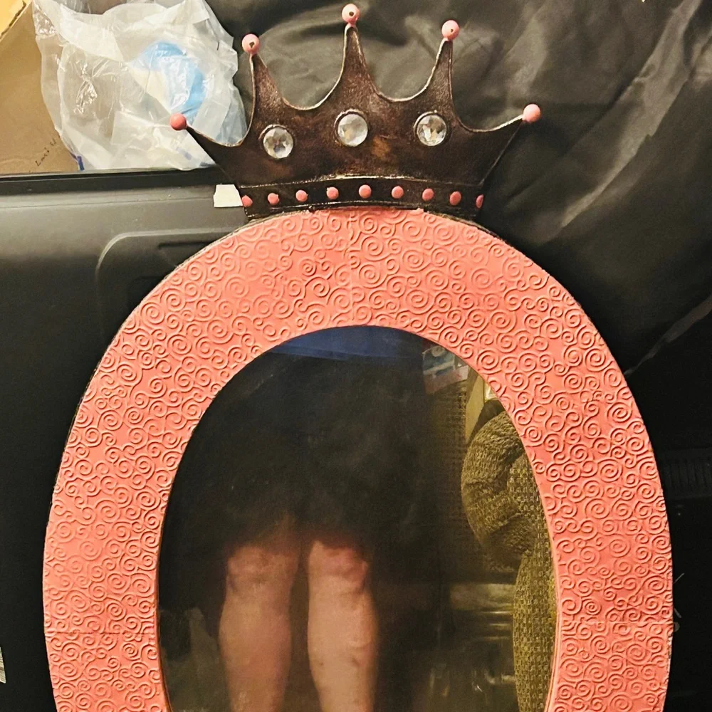 The frame is peach/points same . Crown is dark rhinestones under points.